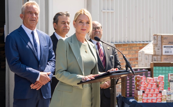 Attorney General Pamela Bondi delivers remarks from a podium in front of a vape products distribution center in Chicago, Illinois. She is joined by HHS Secretary Kennedy and federal government officials.